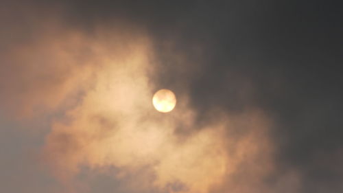 Low angle view of moon against sky at sunset