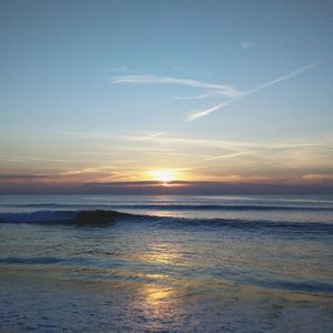 Scenic view of sea against sky at sunset