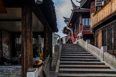 Low angle view of staircase amidst buildings in old town