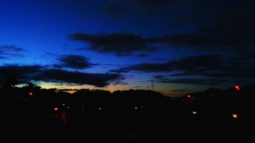 Silhouette landscape against scenic sky