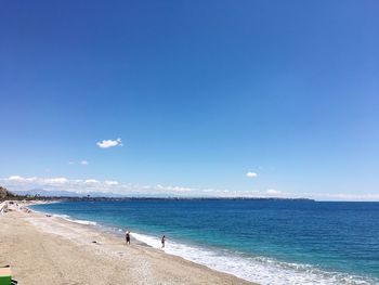 Scenic view of sea against blue sky