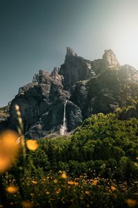 Scenic view of rocky mountains against clear sky