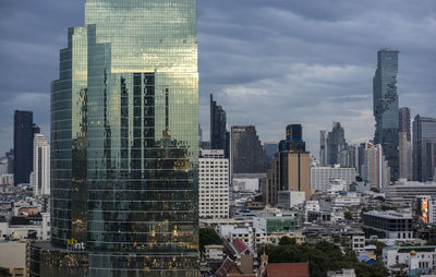 Buildings in city against sky