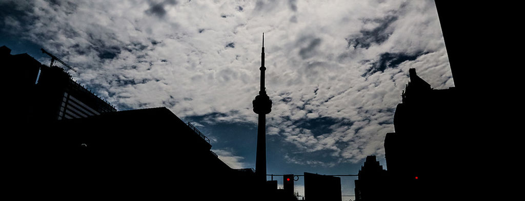 LOW ANGLE VIEW OF TOWER AGAINST CLOUDY SKY