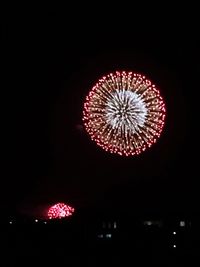 Low angle view of illuminated ferris wheel