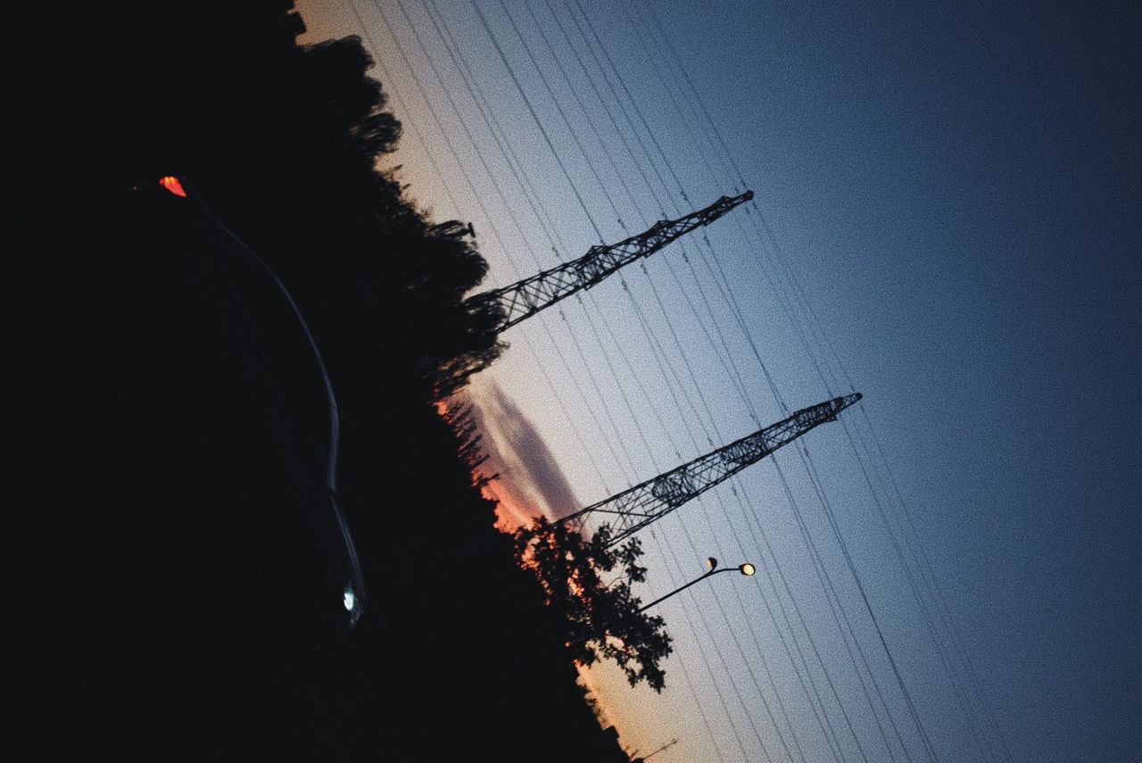 LOW ANGLE VIEW OF SILHOUETTE TREES AGAINST SKY AT SUNSET