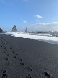 Scenic view of beach against sky