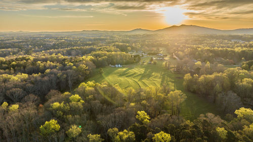 High angle view of trees against sky during sunset