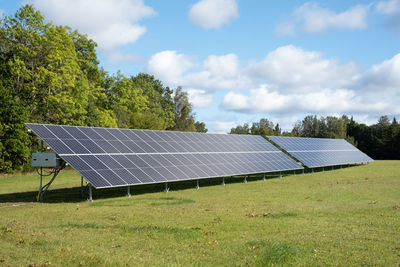 Solar panels on a green grass field