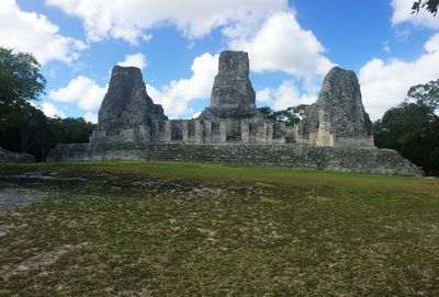 Ruins of building against cloudy sky
