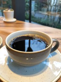 Close-up of coffee cup on table