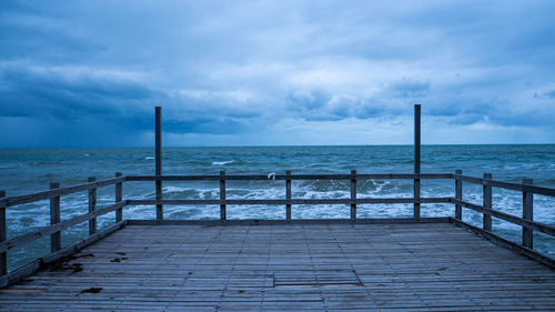 Pier over sea against sky