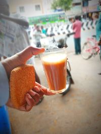 Midsection of woman holding drink