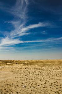 A barren land meets meets a blue sky. al qudra dubai uae