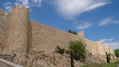 Low angle view of fort against blue sky