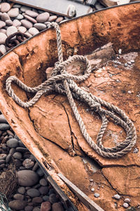 High angle view of rope tied on wood