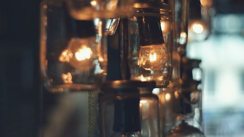 Close-up of illuminated light bulbs in darkroom