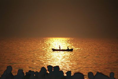 Silhouette of boat in sea