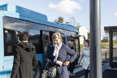 Senior women at bus station