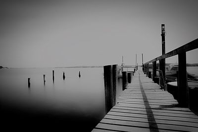 Pier over sea against clear sky
