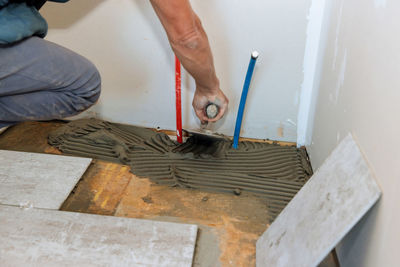 Low section of man working at workshop