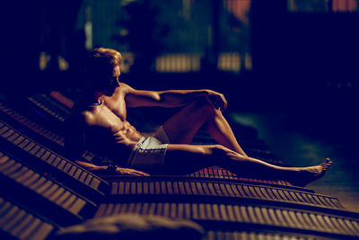 Young woman sitting outdoors