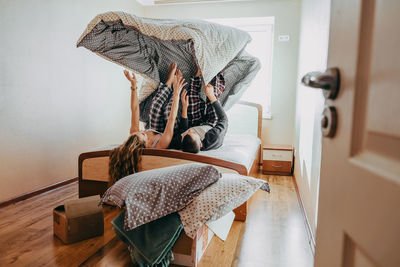 Woman sitting on chair at home