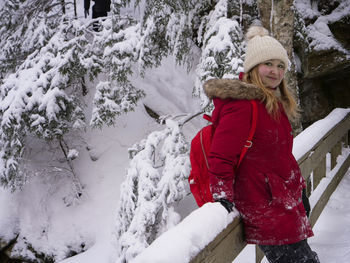 A young woman enjoys a hike in the beautiful wilderness of algonquin provincial park.