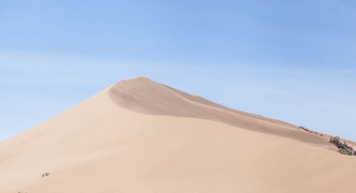 Scenic view of desert against clear sky