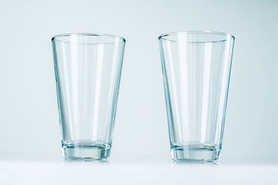 Close-up of drinking glass against white background