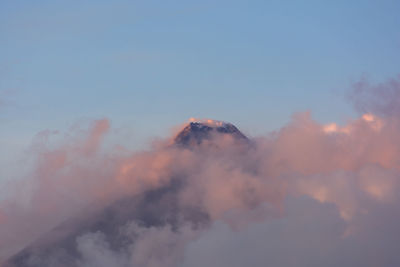 Low angle view of mountain against sky during sunset