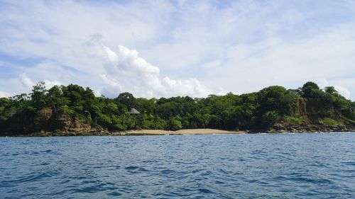 Scenic view of sea against cloudy sky