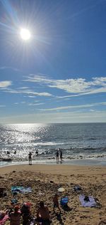 Scenic view of sea against sky on sunny day