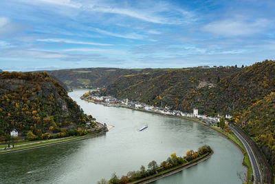 High angle view of river rhine from loreley midst trees against sky