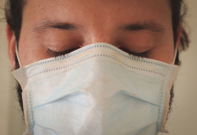 Close-up portrait of a man covering face