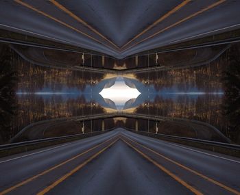 Digital composite image of illuminated road against sky at night