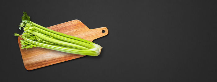 High angle view of chopped vegetables on table against black background