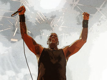 Shadow of man with arms raised