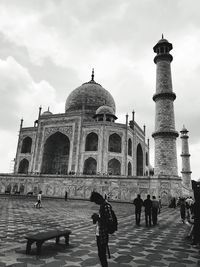 Group of people in front of historical building