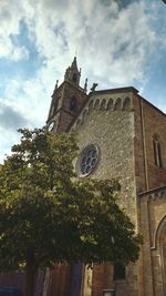 Low angle view of bell tower against sky