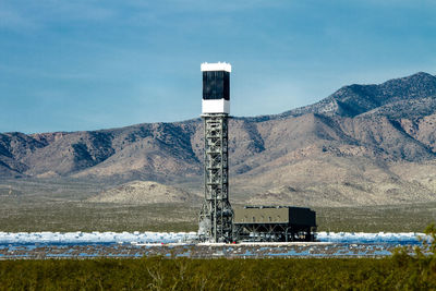 Solar thermal power plant against mountains