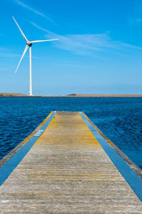 Scenic view of sea against blue sky