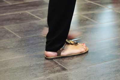 Low section of woman standing on floor