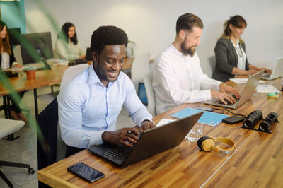 Business colleagues working at table