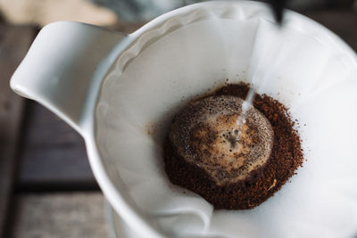 Barista dripping coffee and slow coffee bar style