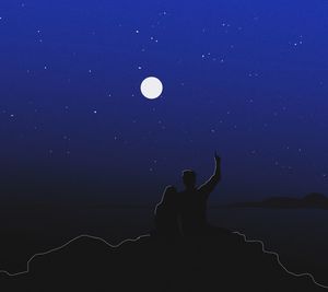 Silhouette woman against blue sky at night