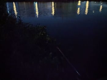 High angle view of lake against sky at night