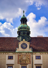 Low angle view of clock tower against sky