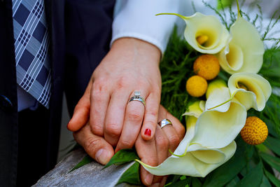 Close-up of couple holding hands