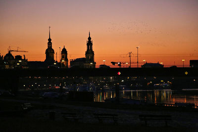 High angle view of illuminated buildings in city at night